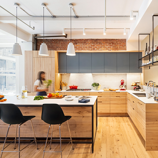 A renovation of a compact loft in Chelsea for a family of four offers a model for family living today, and is made with close to 100% reclaimed wood.